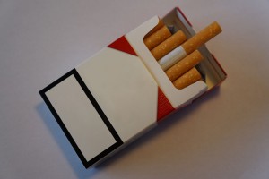 Blank_cigarette_packet_with_logo_removed_and_cigarettes_sticking_out